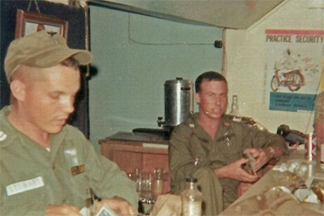After the days missions are complete, CPT Stewart shuffles a deck of cards as CPT Mulheren watches.