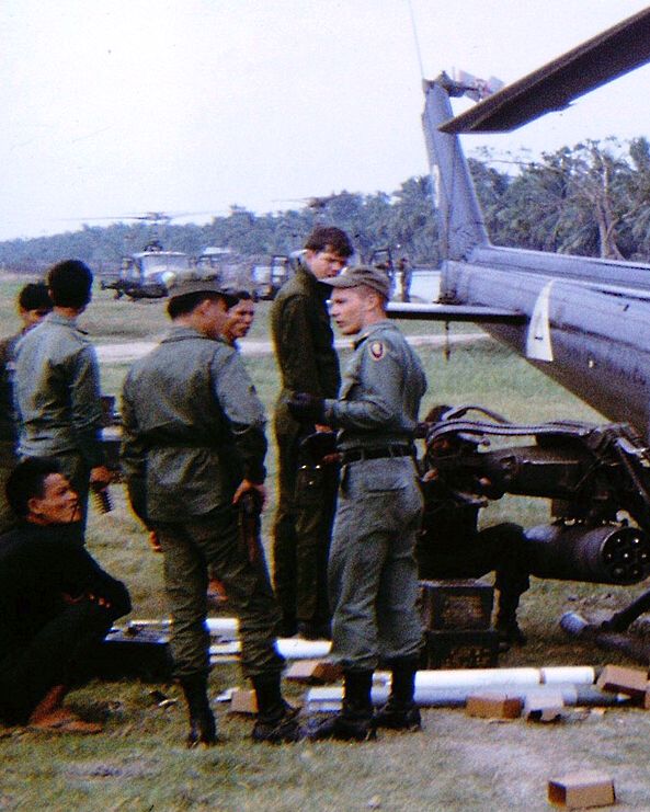 Captain Stewart confers with a Vietnamese officer during the conduct of a mission to support ground operations.