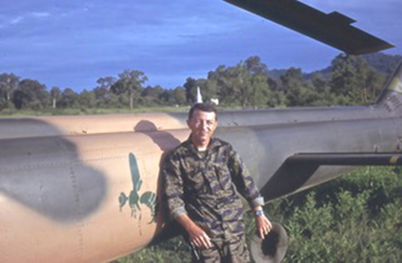 Captain Viviano next to gunship on stripe alert